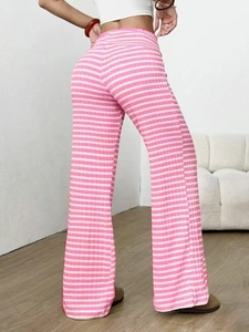 Macro shot of pink and white striped ribbed knit fabric on high-waist flared pants