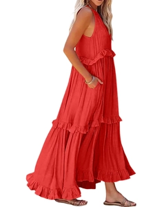 Close-up of red tiered maxi dress featuring textured ruffled edges and pleated fabric detail