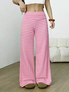 Detail of pink and white striped ribbed knit trousers with an elastic high waistband