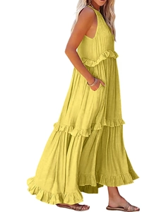 Detail view of ginger yellow tiered maxi dress featuring ruffle layers and side pockets
