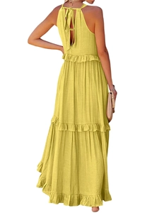 Detail of summer tiered maxi dress with halter neckline and back tie bow design