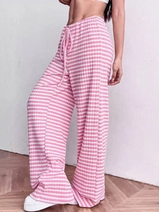 Detail of pink and white striped knit wide-leg pants with adjustable drawstring waist