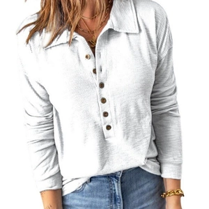 Women's white long sleeve ribbed shirt featuring a lapel collar and wooden buttons
