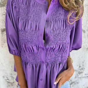 Women's purple smocked short sleeve blouse with round neck and buttons in casual summer style