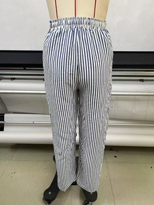 Detailed back view of elastic waistband and blue striped fabric on wide leg pants