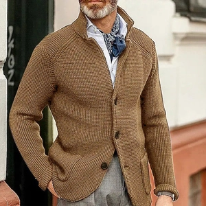 Detail of camel waffle knit texture on men's cardigan with stand collar and front pockets