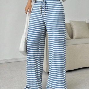 High-waist blue and white striped wide-leg trousers with drawstring and textured knit fabric