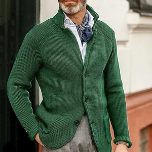 Close-up of green waffle knit cardigan showing thick texture and button detail