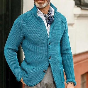 Detail of blue waffle knit texture and black buttons on men's stand collar cardigan jacket