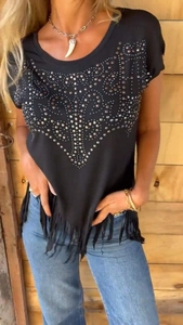 Detail view of black round-neck T-shirt featuring silver studs and long fringe hem tassels