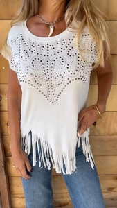 Detail of white round neck T-shirt featuring rhinestones and asymmetrical fringe hemline