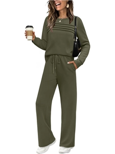 Detail of olive green lounge set showing pleated crewneck top and drawstring waist pants