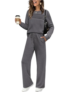 Detail of grey lounge set featuring chest pleats, drawstring waist, and wide legs