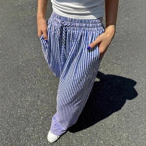 Blue and white striped wide-leg pants with elastic drawstring waist and side pockets
