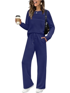Detail of navy blue lounge set featuring a pleated crewneck top and drawstring wide-leg pants