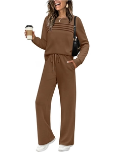 Detail of caramel brown long sleeve top with pleated chest design and drawstring wide leg pants