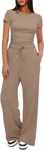 Detail of tan two-piece summer set featuring pleated short sleeve top and wide-leg pants