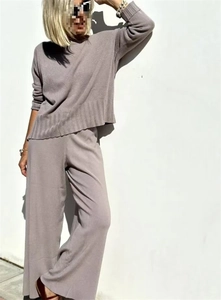 Detailed knit texture and drape of the grey-purple two-piece wide-leg pants sweater set