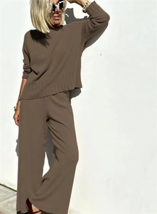Detail of loose-fit knit two-piece set featuring ribbed hem and wide-leg trousers
