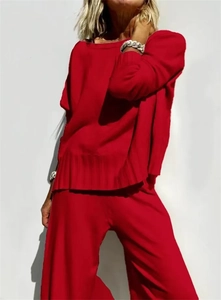 Detailed texture of red knit set featuring soft vertical stripe patterns and ribbed hems