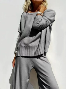 Detail view of grey knit set featuring ribbed cuffs and loose fit wide-leg pants