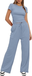 Detail of light blue pleated two-piece set featuring short sleeve top and drawstring pants