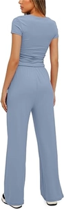 Rear view of woman in light blue short sleeve top and matching high waist wide leg pants