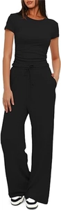 Detail of black short sleeve top and high waist wide leg trousers with drawstring waist