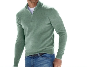 Detail of light green 1/4 zip men's knit sweater featuring fine fabric texture and collar