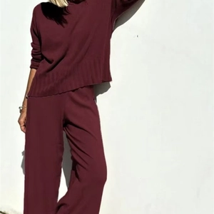 Chic burgundy knit two-piece set with long-sleeve sweater and wide-leg trousers for women