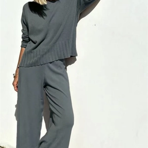Minimalist dark grey knitted two-piece set with long-sleeve sweater and wide-leg trousers