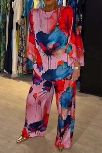 Close-up of elegant floral print satin fabric texture on high-waist wide-leg pants