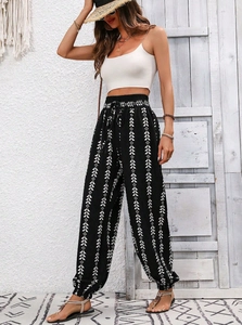 Detail of bohemian harem pants with geometric prints and elastic drawstring waist