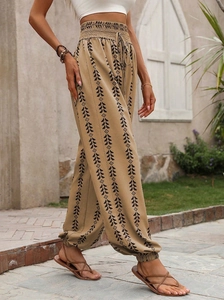 Detail of bohemian geometric print harem pants with high elastic waist and drawstring