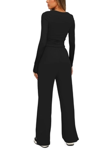 Rear view of sleek black two-piece set featuring slim long sleeve top and wide leg pants