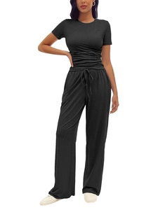 Detail of black two-piece lounge set with pleated short sleeve top and drawstring pants