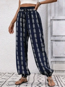 Close-up of bohemian high waist printed trousers with drawstring and elastic ankle cuffs