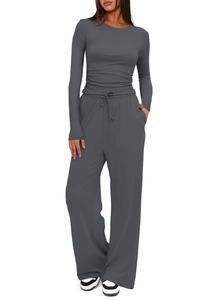 Detail view of dark grey lounge set featuring drawstring wide-leg pants and long-sleeve top