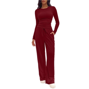 Detail view of deep red ribbed lounge set with long sleeve top and drawstring pants
