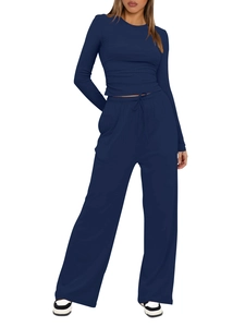 Detail of navy blue two-piece lounge set with ribbed long sleeve top and wide leg pants