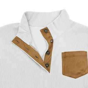 Detail of corduroy sweatshirt with suede pocket and silver snap button on stand collar