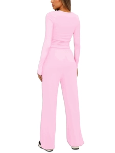 Detail view of pink long sleeve top and wide-leg pants set back silhouette