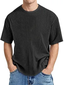 Detail of dark grey short sleeve T-shirt featuring jacquard textured grid fabric