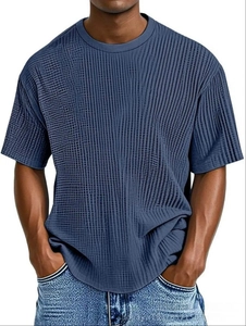 Detailed view of dark blue men's T-shirt featuring vertical micro-pleated texture fabric