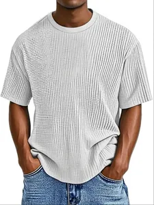 Detail showing the vertical stripe texture on a white crew neck short sleeve T-shirt