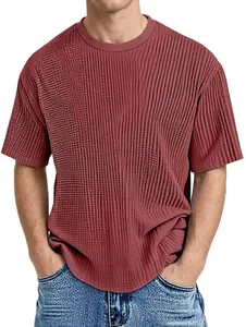 Close-up of brick red men's T-shirt featuring a vertical ribbed texture and crew neck