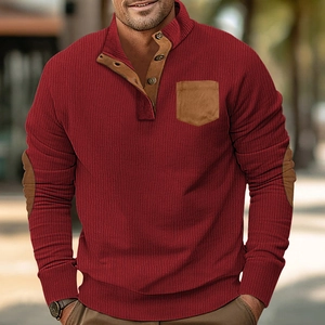 Detailed close-up of corduroy texture and contrasting elbow patches on men's winter pullover