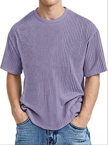 Close-up of lilac men's T-shirt showing waffle knit texture and classic crew neck detail