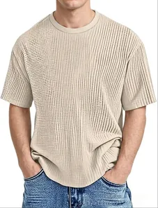 Detail shot of men's summer t-shirt showing vertical stripe waffle texture in beige