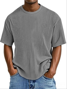 Detailed view of grey men's summer t-shirt showing waffle knit fabric and crew neck